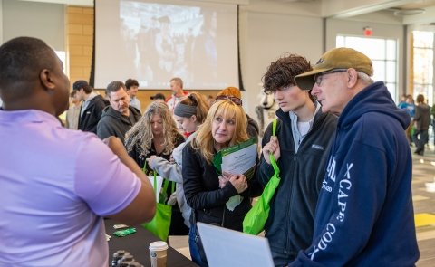 SUNY Adirondack Director of EOP Sam Johnson, left, talks to guests at SUNY Adirondack's Fall 2024 Open House event.