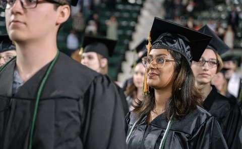 Graduates march into the 2024 commencement ceremony at CIA
