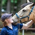 Mia Durham with a horse she is caring for