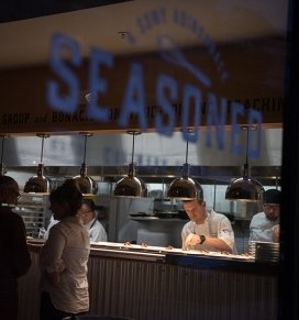 Chef Matt Bolton is seen preparing food at Seasoned restaurant