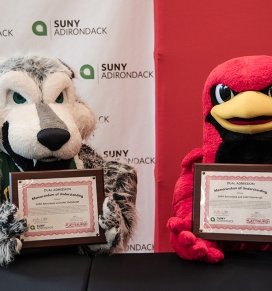 SUNY Adirondack and SUNY Plattsburgh mascots at the dual admissions signing