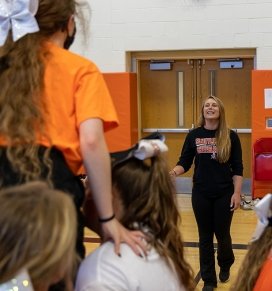 SUNY Adirondack alumna Charlene Becker coaches Schuylerville's varsity cheerleading squad.