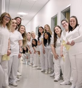 Nursing students line up to walk into the Spring 2024 pinning ceremony
