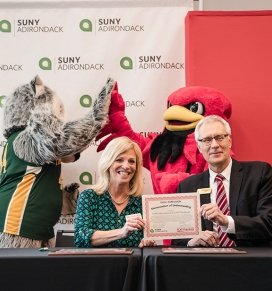 SUNY Adirondack President Kristine D. Duffy and SUNY Plattsburgh President John Ettling sign a dual acceptance agreement