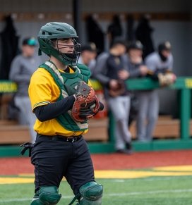 The catcher on the baseball team getting ready for a play