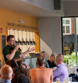 Whitman Brewing Company head brewer talking to Collaborative Cuisine guests