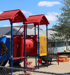 The on-campus child care center's outdoor play yard is seen
