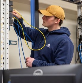 A student works on a network in a Enterprise Networking class