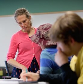 SUNY Adirondack adjunct instructor Katherine Patterson looks over a student's work in class