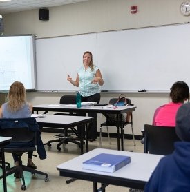 Math professor April Teer speaking in a classroom