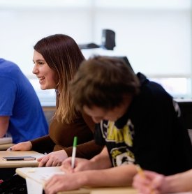 A student laughs during a discussion in a Political Science class.