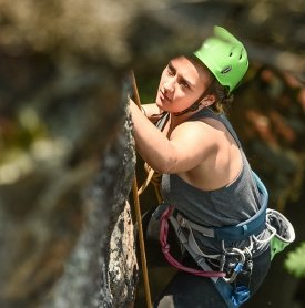 A SUNY Adirondack Outdoor Education student climbs in the Adirondacks