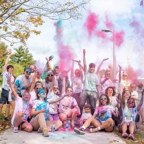 Students covered in paint after the color run