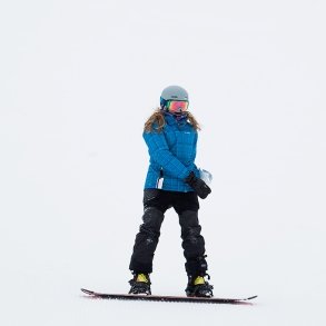 Student on a snowboard at West Mountain