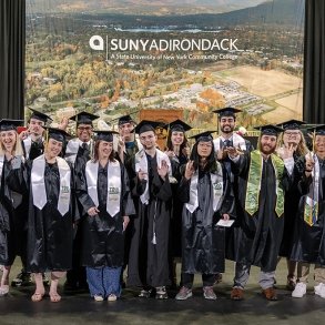 Trio students in caps and gowns at the 2024 graduation ceremony