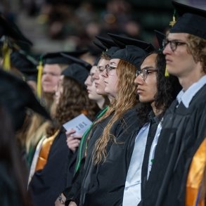 Graduates listen to a speaker at Commencement 2024
