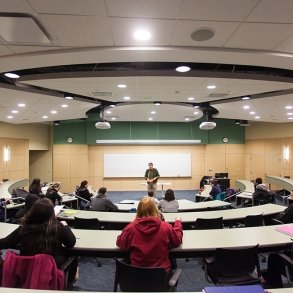 Students listen to a professor delivering a lesson in the lecture hall at SUNY Adirondack Saratoga