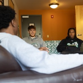 Students visit in a common area of the Residence Hall