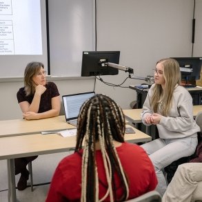 English professor Stephanie Droto works with students in class