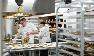 Culinary students work in the Seasoned kitchen