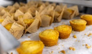 A line of cornbread muffins is seen on a counter at Seasoned