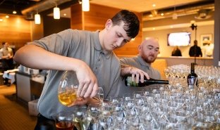 Students pour wine as part of Vintners Night at Seasoned.