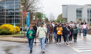 SUNY Adirondack campus and community members walk in the 2025 Walk Out of Darkness event on campus.