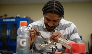 A student learns in a boot camp session