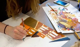 A student works on a painting