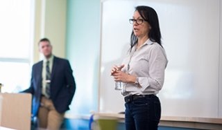 An instructor delivers training in front of a classroom at SUNY Adirondack Saratoga