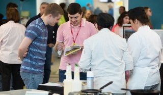 Prospective students visit an Open House event