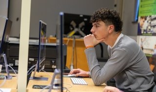 An Early College Career Academy student works in a New Media class