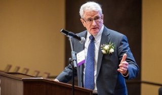 Longtime SUNY Adirondack trustee Robert Judge accepts an award at NYCCT.