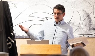 Associate Professor of English Peter Fernbach introduced Pulitzer Prize-winning author William Kennedy at a 2026 Writers Project event in the Visual Arts Gallery in Dearlove Hall.