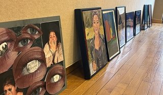 Student-created artworks line the wall of the Visual Arts Gallery, waiting to be considered for the annual Student Exhibition.