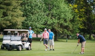 A foursome golfs during the Beeman Classic Golf Tournament, a fundraiser for SUNY Adirondack Foundation