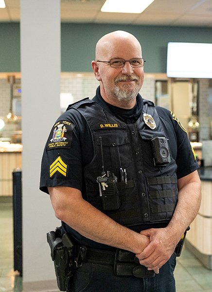 Public Safety Officer Dave Willis is seen in the dining hall.