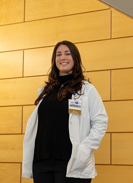 Amanda Rose Mastropietro stands in a hallway at SUNY Adirondack, where she discovered a passion for teaching one to one.
