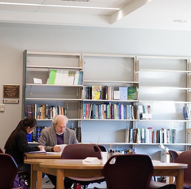 Two people work on an assignment in the Center for Reading and Writing