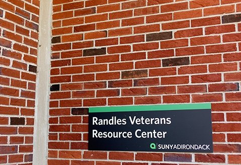 A sign indicates the location of Randles Veterans Resource Center in the Student Center at SUNY Adirondack's Queensbury campus