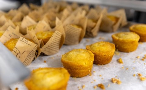 A line of cornbread muffins is seen on a counter at Seasoned