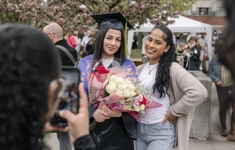 Two females celebrating an EOP students graduation 