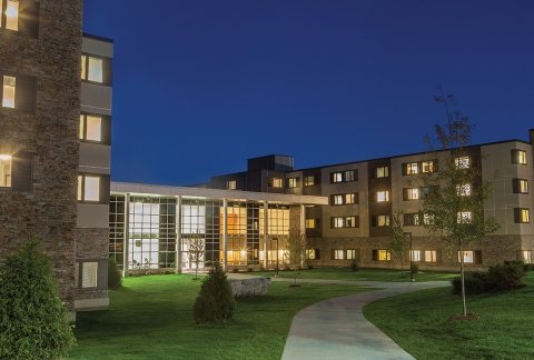 Exterior image of the residence hall in the evening
