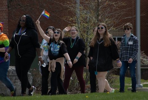 Students and community members walk through campus during a suicide awareness walk