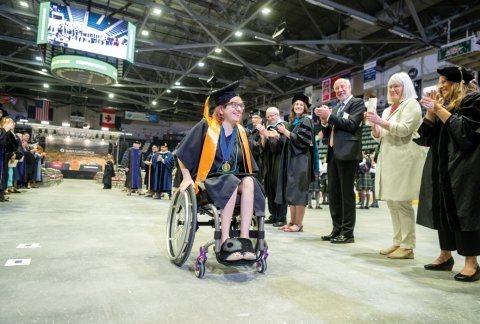Graduate in wheelchair leaving ceremony to a standing ovation