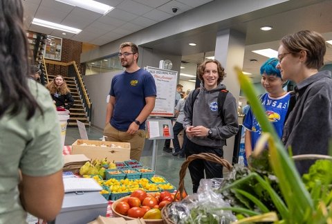Agriculture students selling produce in the college's cafeteria 