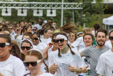 A mass start of students running the Color Run