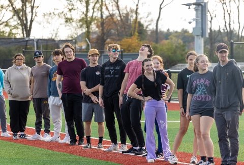 Students lining up for a teambuilding event on the Turf