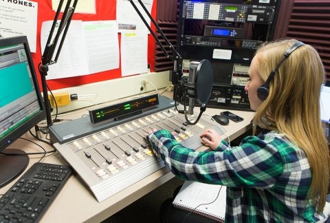 Students DJ working in the radio station