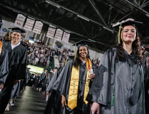 Graduates walk in to commencement 2024